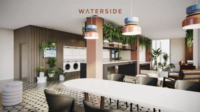 Laundry machines plants and seating common area at Waterside in Bristol Student Accommodation