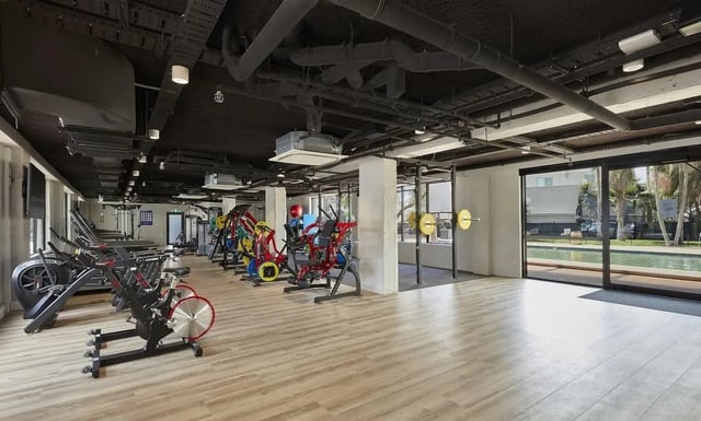 Gym equipment treadmills weights and pool area gym at Campus Melbourne in Melbourne Student Accommodation