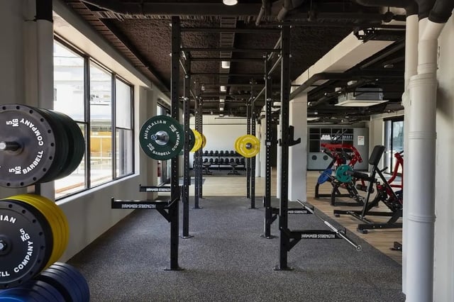 Weight plates barbell racks and weight machines gym at Campus Melbourne in Melbourne Student Accommodation
