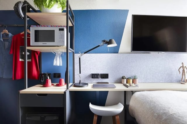 Microwave kettle cups and desk in bedroom at Campus Melbourne in Melbourne Student Accommodation