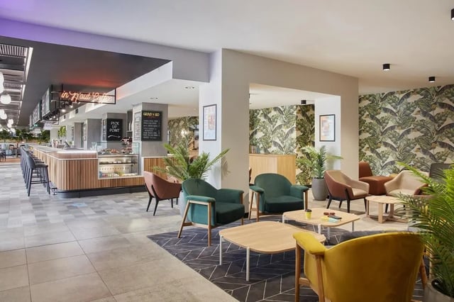 Chairs tables and counter area lounge area at Campus Melbourne in Melbourne Student Accommodation