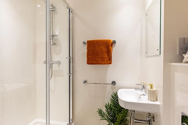 Shower sink towel rack mirror bathroom at The Port On The Square in Bristol Student Accommodation