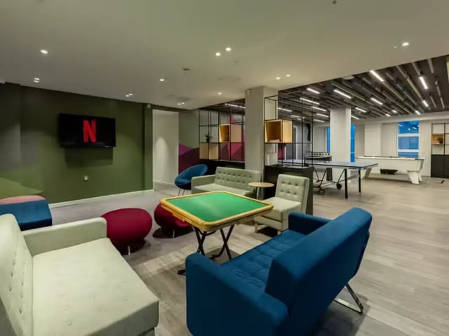 Sofas ping pong and pool tables common area at Grosvenor House in London Student Accommodation