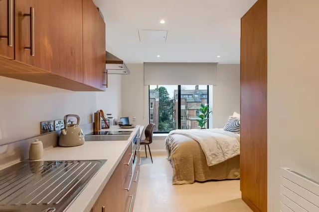 Modern studio apartment with kitchenette bed and study area at Ryan Hall in Belfast Student Accommodation