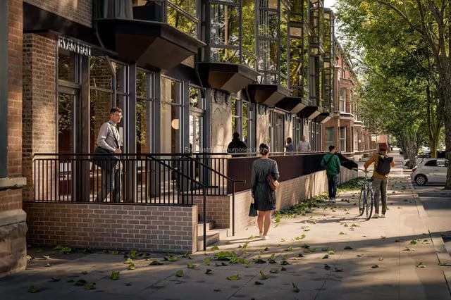 Modern building entrance with people and bicycles exterior at Ryan Hall in Belfast Student Accommodation