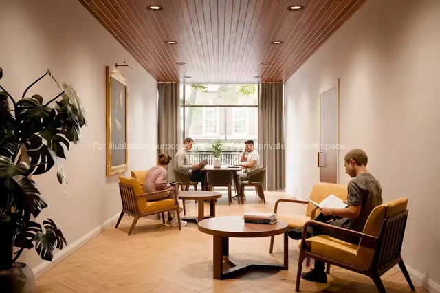 Students relax in a communal lounge with chairs and tables lounge at Ryan Hall in Belfast Student Accommodation