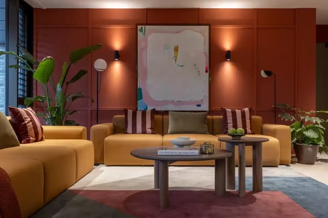 Yellow sofas artwork and plants living room at The Pepper Mill in Edinburgh Student Accommodation