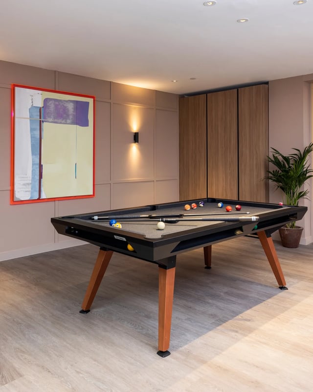 Pool table with balls and cues playing area at The Pepper Mill in Edinburgh Student Accommodation