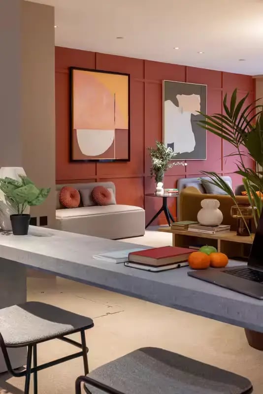 Lounge with art, desk, laptop, fruit, plants living room at The Pepper Mill in Edinburgh Student Accommodation