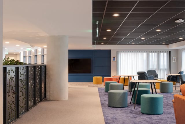 Pouf tables chairs and television lounge area at Aspen Dublin in Dublin Student Accommodation