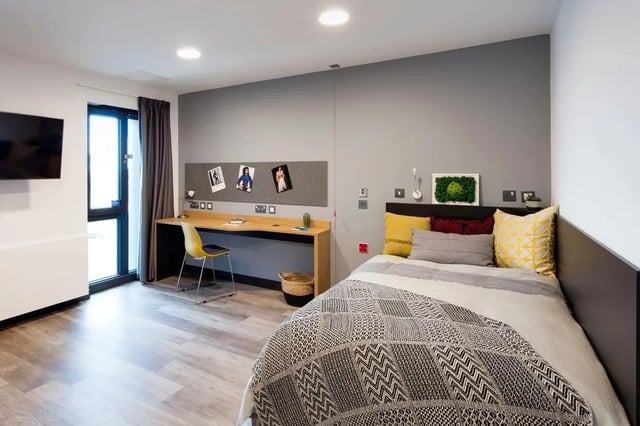 Bed desk television and door bedroom at Aspen Dublin in Dublin Student Accommodation