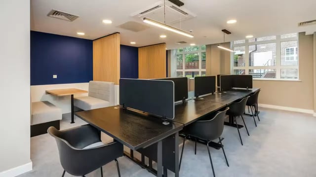 Desk with monitors and chairs study area at St Gabriels in Manchester Student Accommodation