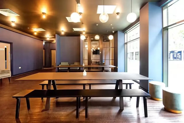 Dining tables and benches communal area at Howard Gardens in Cardiff Student Accommodation