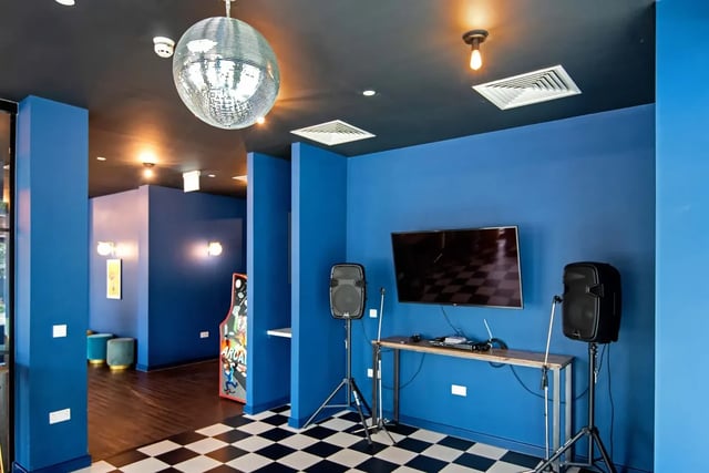 Disco ball TV speakers arcade machine common room at Howard Gardens in Cardiff Student Accommodation