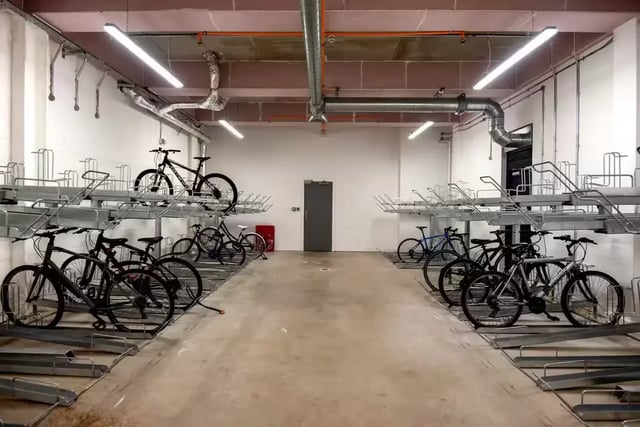 Bicycles on racks in a storage area exterior at Howard Gardens in Cardiff Student Accommodation