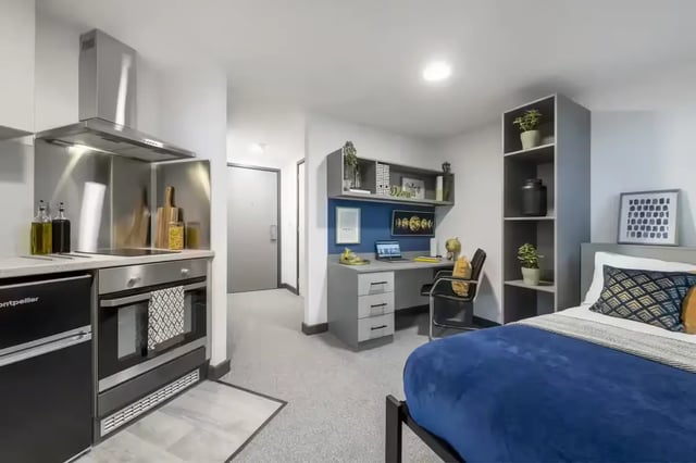Kitchen desk bed and shelves studio apartment at Compass in Birmingham Student Accommodation