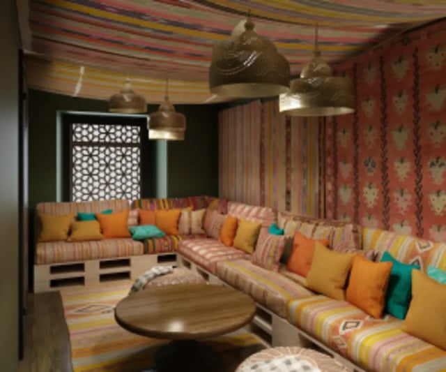 Comfortable lounge seating with patterned cushions living room at Iconinc The Bonnie in Glasgow Student Accommodation