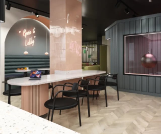 Modern communal space with seating and laptop study area at Iconinc The Bonnie in Glasgow Student Accommodation