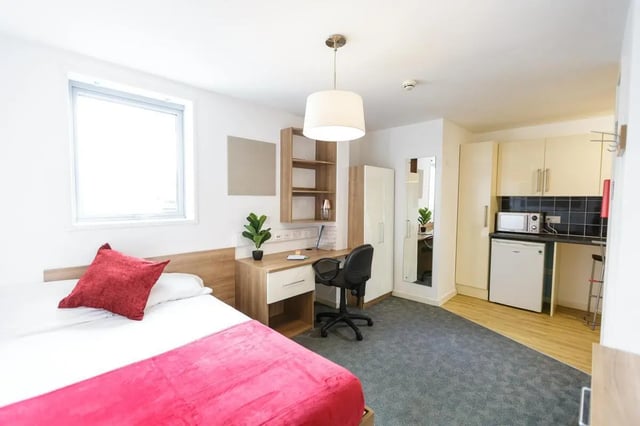 Bed desk wardrobe kitchen area studio apartment at AXO Islington in London Student Accommodation