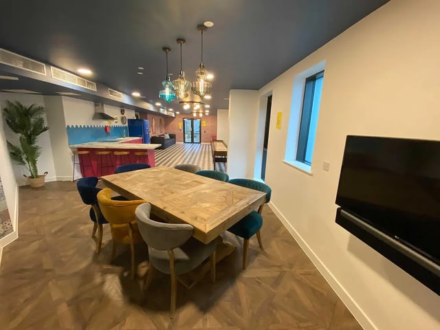 Dining table chairs and kitchen counter living area at Yugo Bailey Point in Bournemouth Student Accommodation