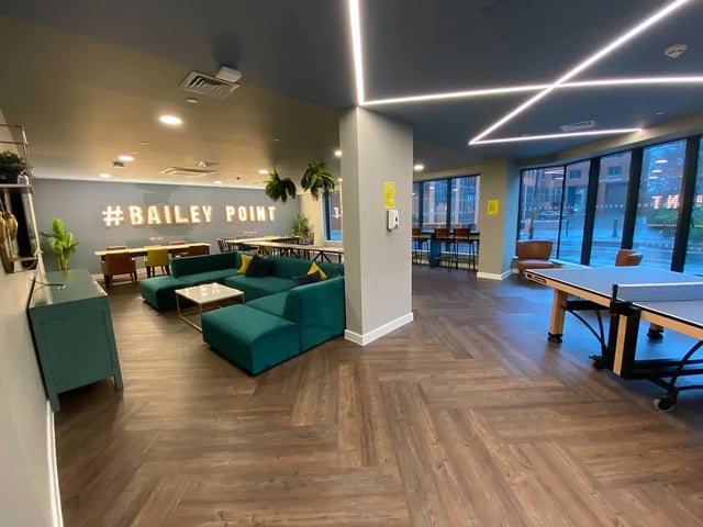 Teal sofa ping pong table common area at Yugo Bailey Point in Bournemouth Student Accommodation