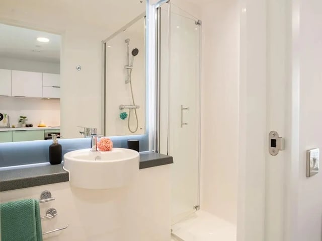 Sink shower and towel rack Bathroom at Promenade Student Living in Brighton Student Accommodation