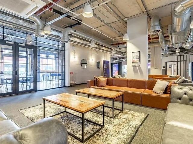 Sofa tables rug living room interior at Globe Works in Birmingham Student Accommodation