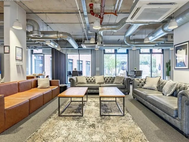 Chesterfield sofas coffee tables living room at Globe Works in Birmingham Student Accommodation