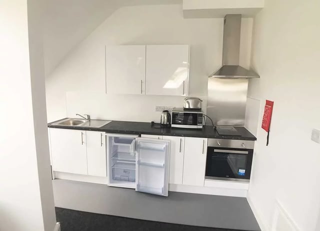 Compact kitchenette with fridge microwave kettle oven kitchen at Forest Rise in Loughborough Student Accommodation