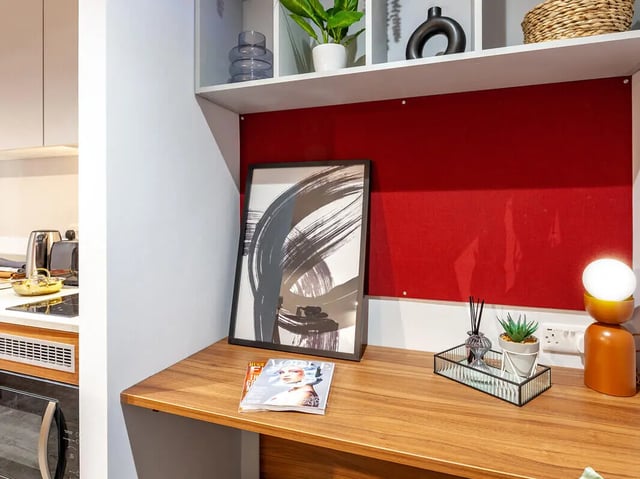 Framed art magazines diffuser lamp study area at Straits Garden in Egham Student Accommodation