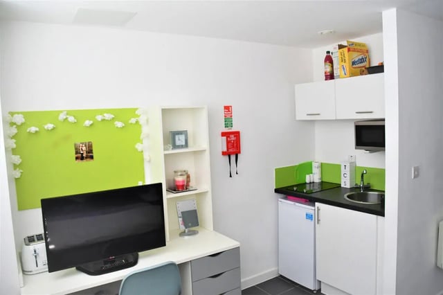 Desk with TV and toaster kitchen area at Tudor Studios in Leicester Student Accommodation