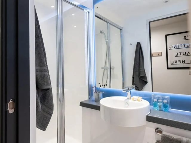 Shower sink mirror framed art towel bathroom at Steelworks in Sheffield Student Accommodation