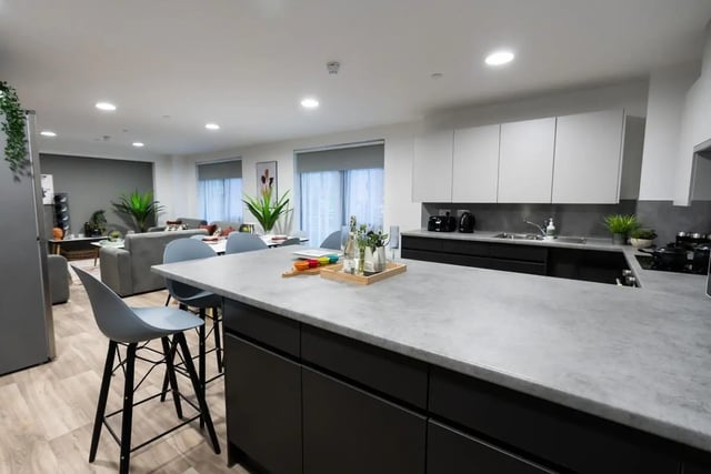 Modern kitchen island with seating and living area kitchen at Steelworks in Sheffield Student Accommodation