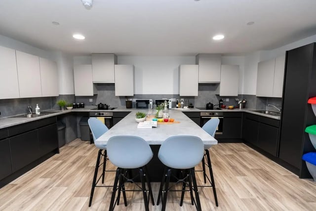 Modern shared kitchen with island and bar stools kitchen at Steelworks in Sheffield Student Accommodation