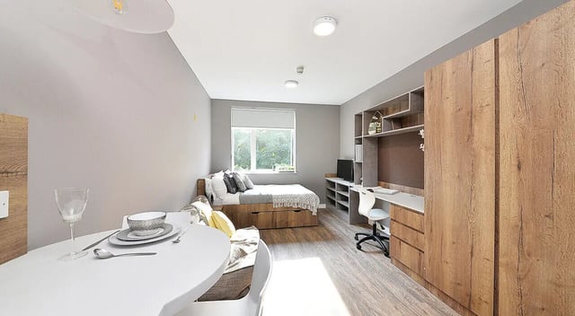 Bed desk wardrobe and dining table bedroom at 800 Bristol Road in Birmingham Student Accommodation
