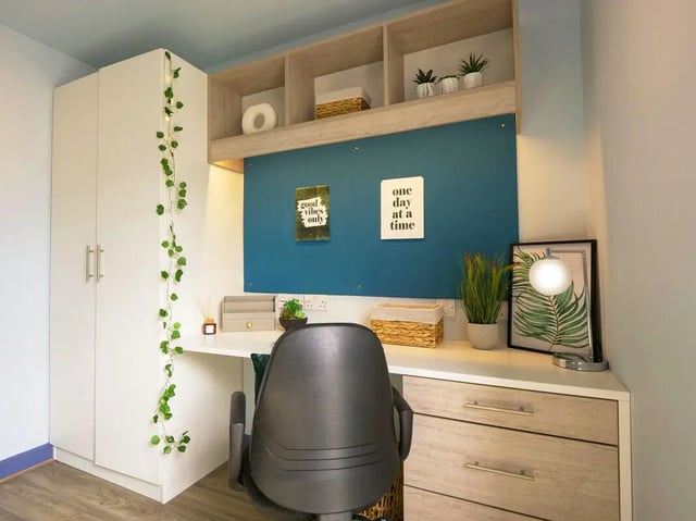 Wardrobe desk chair and shelves study area at Bright House in Kingston Upon Thames Student Accommodation