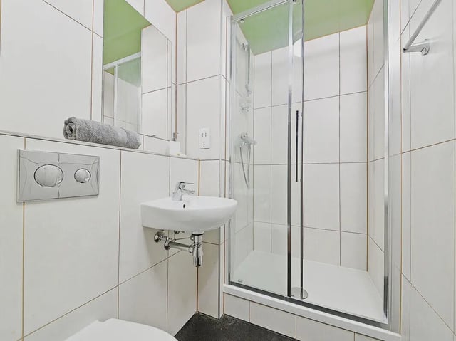 Small sink glass shower enclosure towel bathroom at Fontenoy Apartments in Liverpool Student Accommodation