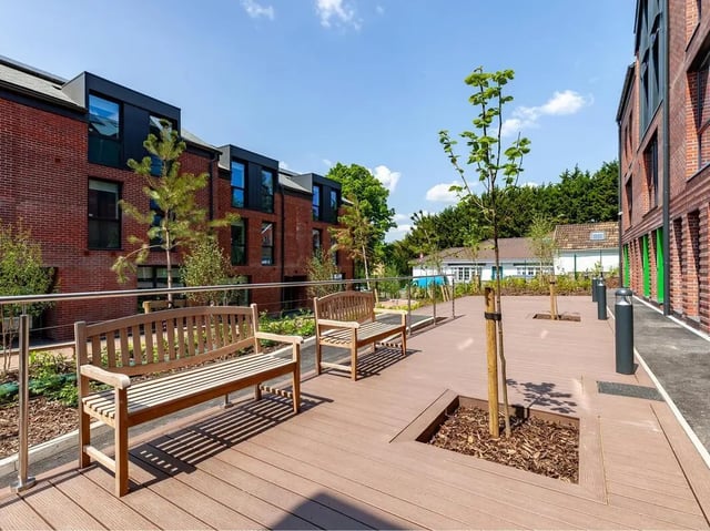 Wooden benches on a wooden deck exterior at Hill View Place in Exeter Student Accommodation