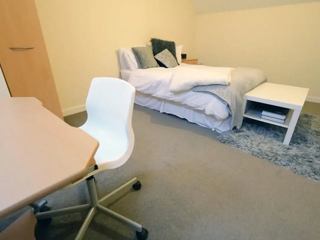 Bed desk chair rug side table bedroom at Hassells Bridge House in Newcastle Under Lyme Student Accommodation