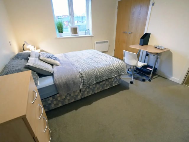 Bed with desk and chair bedroom at Hassells Bridge House in Newcastle Under Lyme Student Accommodation