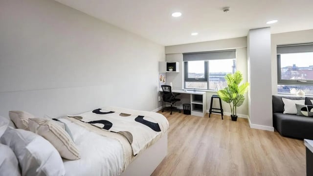 Bed desk chair sofa plant living room bedroom at Clyde Court in Glasgow Student Accommodation