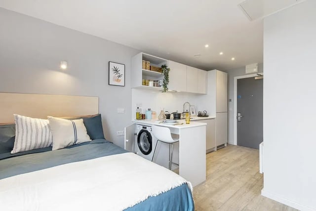 Bed with kitchen appliances and washing machine studio at Hillside House Sheffield in Sheffield Student Accommodation