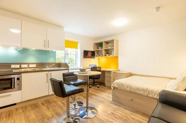 Studio apartment with kitchen bed desk chairs living room at Iron Bridge Studios in Exeter Student Accommodation