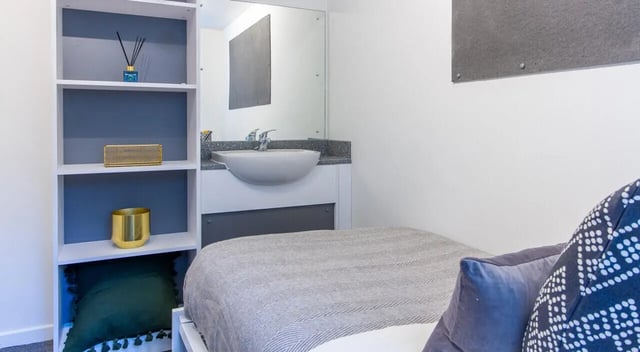 Bed sink shelves and decor bedroom at Green Wood Court in Southampton Student Accommodation