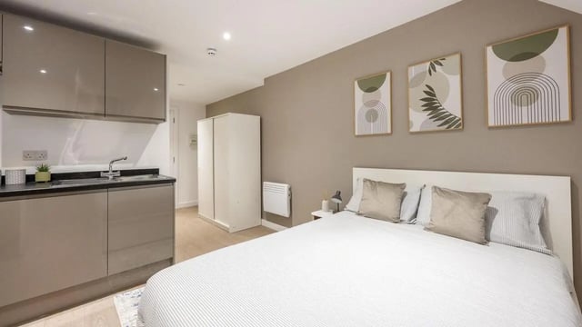 Kitchen bed wardrobe wall art bedroom at Sizer Court in Preston Student Accommodation