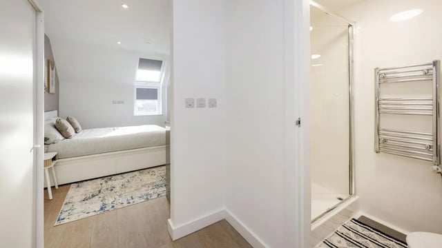 Bed with storage and shower room bathroom at Sizer Court in Preston Student Accommodation