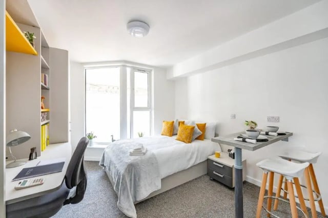 Bed desk and dining table with stools Bedroom at Foundry Studios in Lancaster Student Accommodation