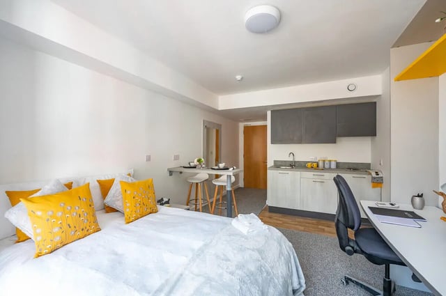 Bed kitchen desk and stools studio apartment at Foundry Studios in Lancaster Student Accommodation