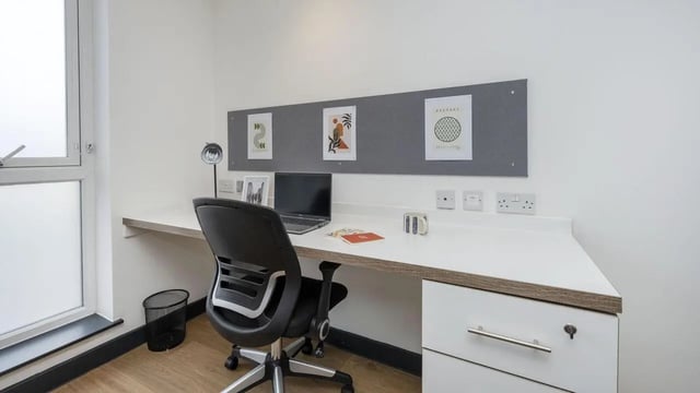 Desk chair laptop mug and art study area at Innovo House in Liverpool Student Accommodation