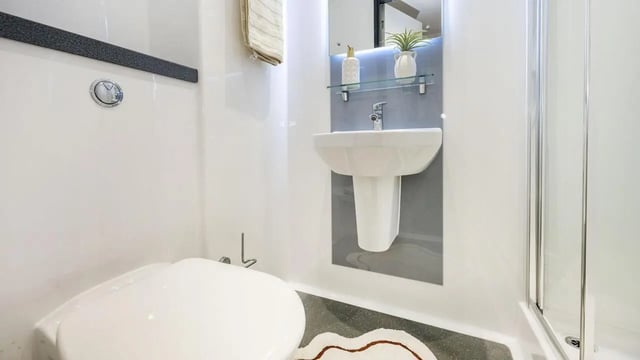 Toilet sink and shower stall bathroom at Innovo House in Liverpool Student Accommodation